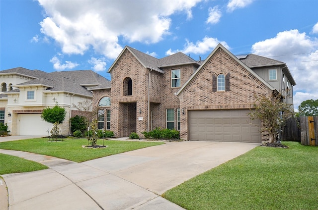 view of front of property featuring a garage and a front lawn