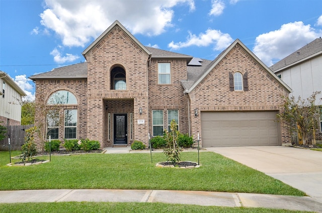 view of front facade featuring a front yard and a garage