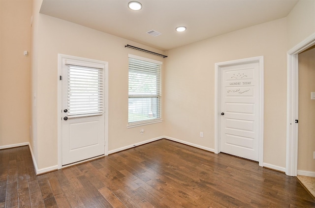 foyer with dark hardwood / wood-style floors