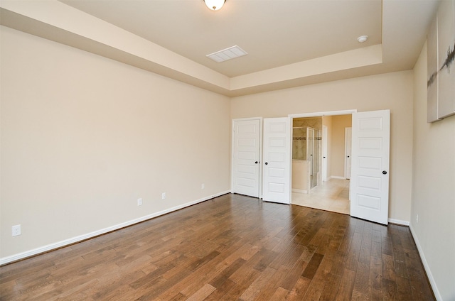 unfurnished bedroom with dark hardwood / wood-style floors