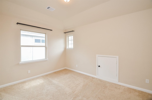 unfurnished room featuring carpet