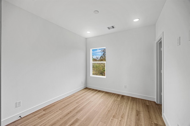 spare room featuring light wood-type flooring