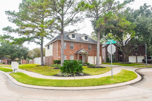 view of front of house featuring a front yard and a garage