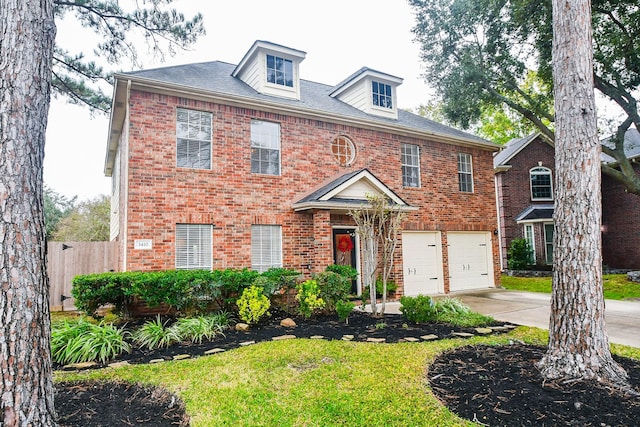 view of front of home featuring a front lawn and a garage