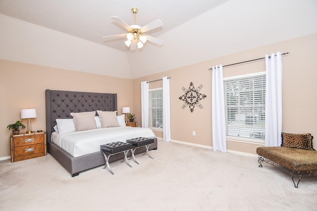 carpeted bedroom featuring ceiling fan and vaulted ceiling