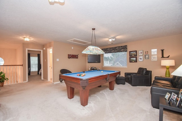 recreation room featuring light carpet, a textured ceiling, and pool table