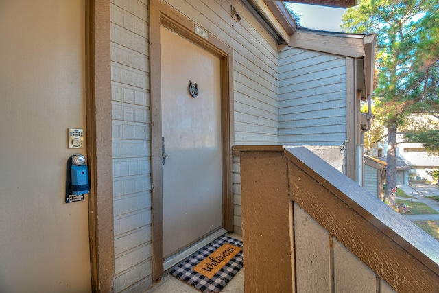 entrance to property with a balcony