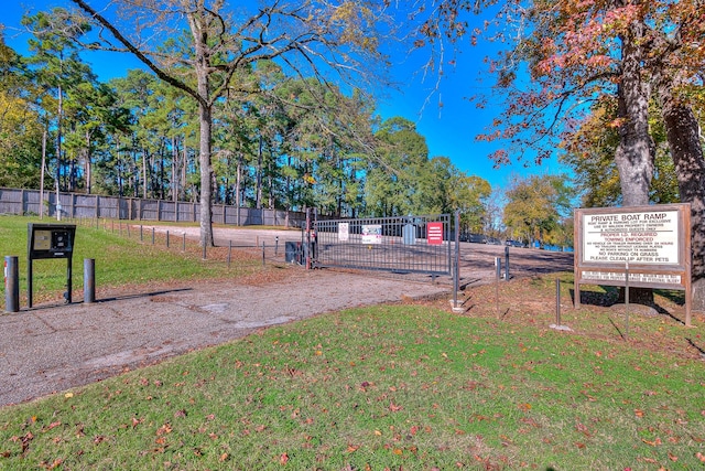 view of home's community with a yard