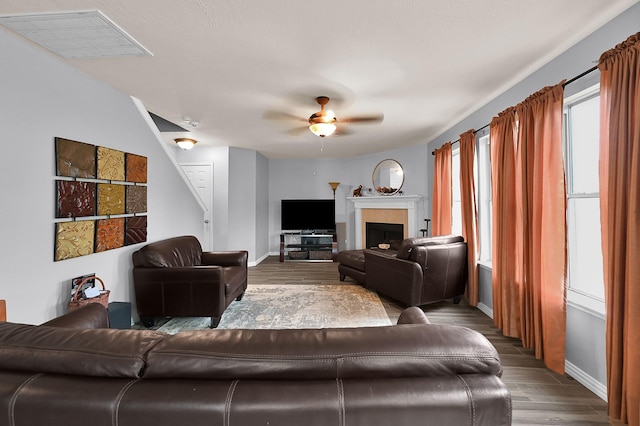 living room with hardwood / wood-style floors and ceiling fan