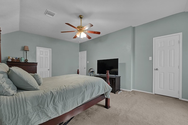 carpeted bedroom with ceiling fan and lofted ceiling