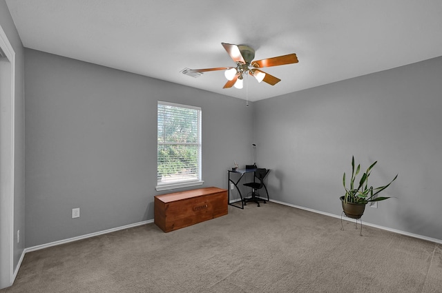 interior space with ceiling fan and carpet floors