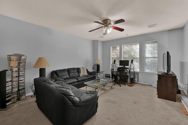 carpeted living room featuring ceiling fan