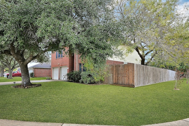 view of yard featuring a garage