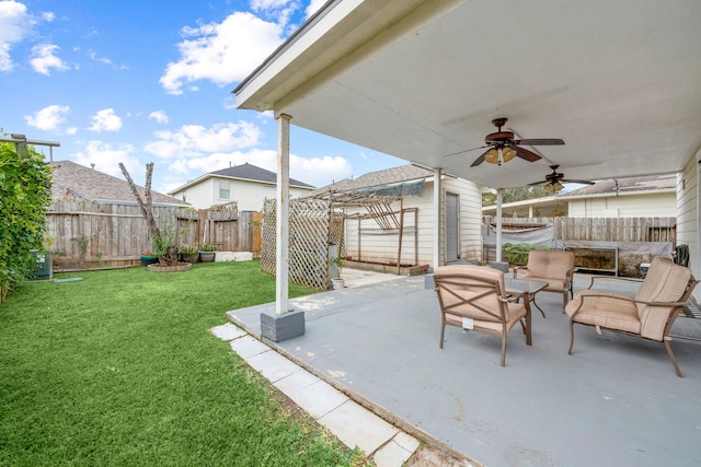 view of patio with outdoor lounge area and ceiling fan