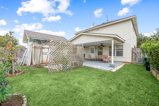 back of property featuring outdoor lounge area, a yard, ceiling fan, and a patio area