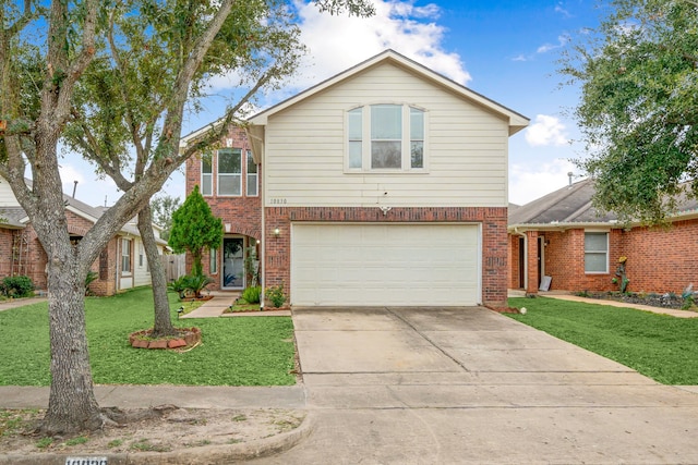 front of property featuring a garage and a front lawn