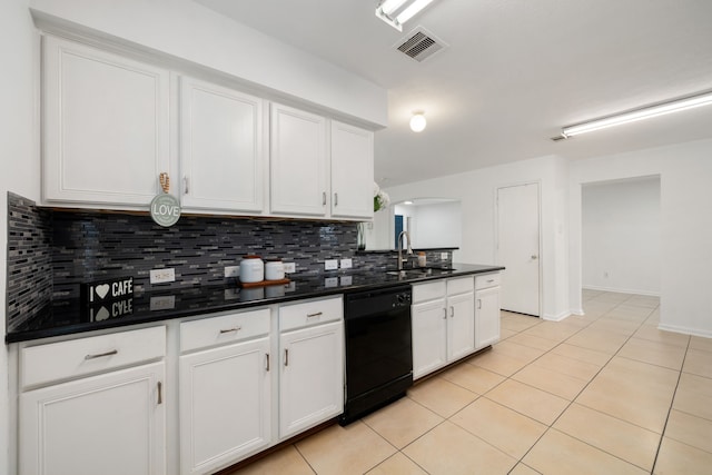 kitchen featuring white cabinets, decorative backsplash, light tile patterned floors, and black dishwasher