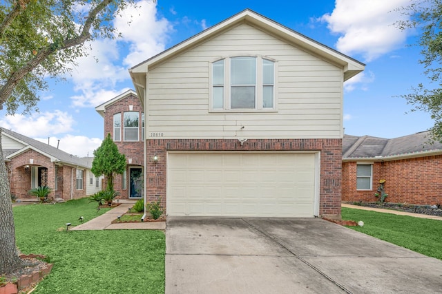 view of property featuring a front yard and a garage