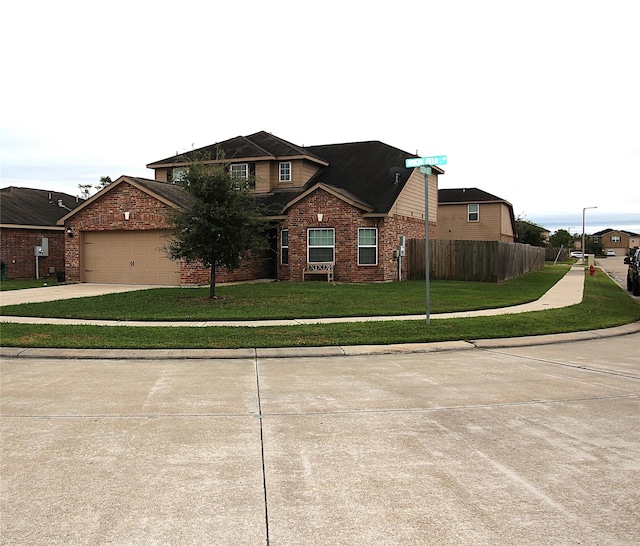 view of front of home featuring a front lawn and a garage