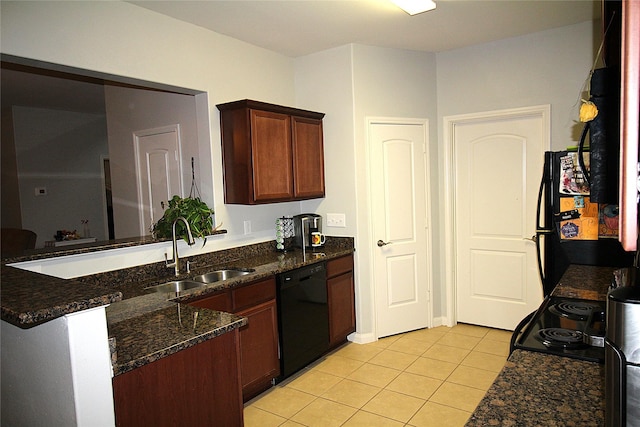 kitchen with black appliances, sink, dark stone countertops, light tile patterned flooring, and kitchen peninsula