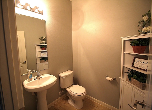 bathroom featuring tile patterned flooring and toilet