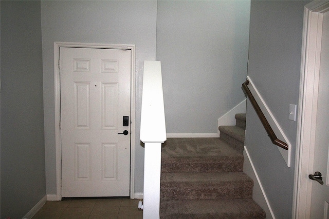 stairs with tile patterned floors