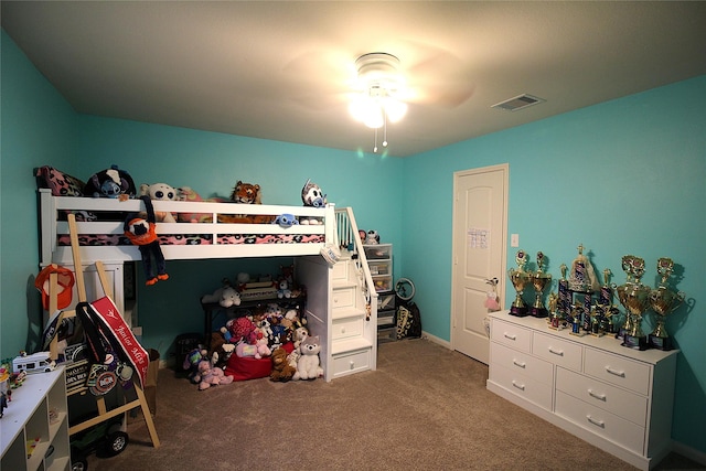 bedroom featuring ceiling fan and carpet