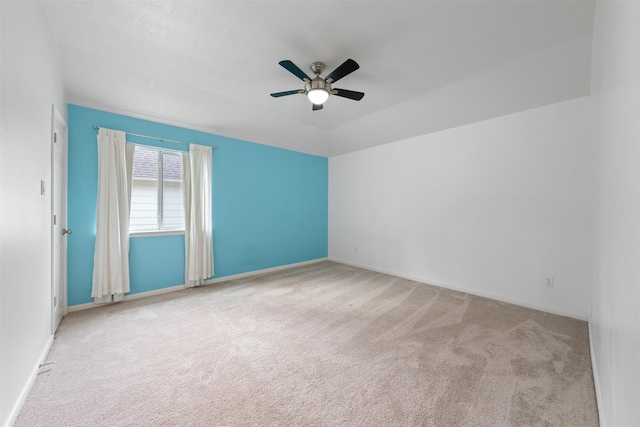 unfurnished room featuring light carpet and ceiling fan