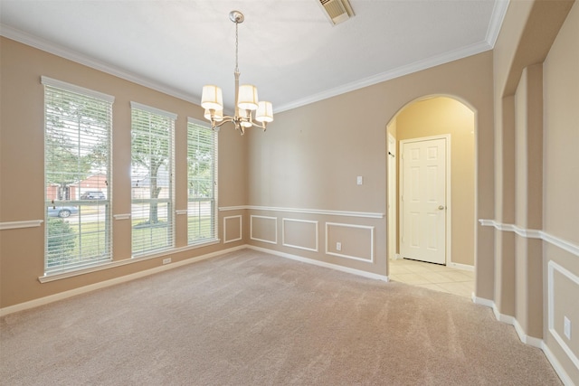 empty room with ornamental molding, light carpet, and a chandelier