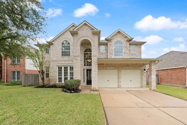 view of front property with a garage and a front yard