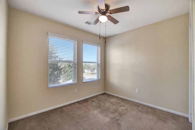 carpeted empty room with ceiling fan