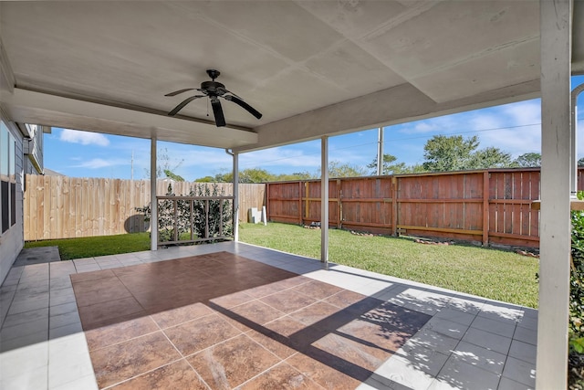 unfurnished sunroom featuring ceiling fan