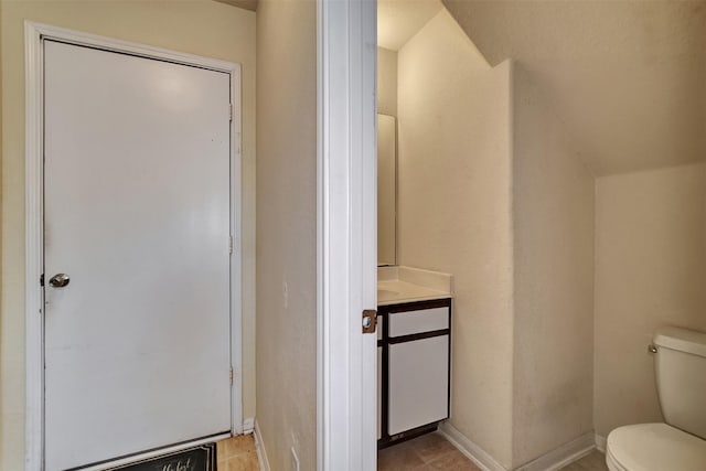 bathroom featuring tile patterned floors and toilet