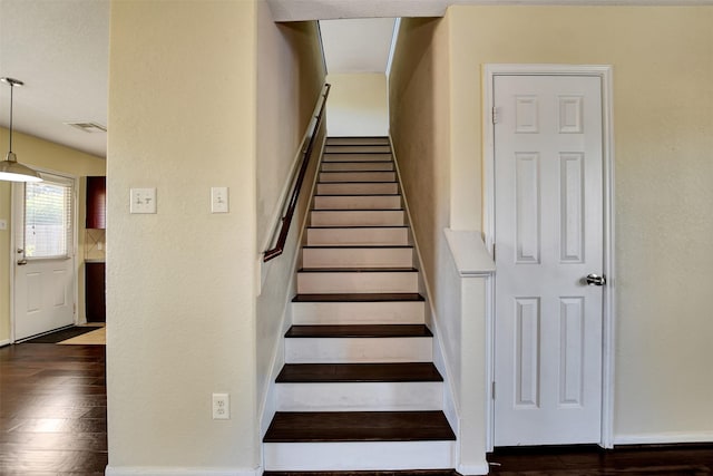 stairway featuring hardwood / wood-style flooring