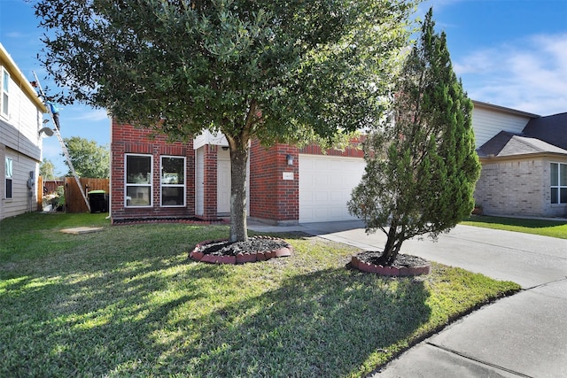 view of front of home featuring a front yard and a garage