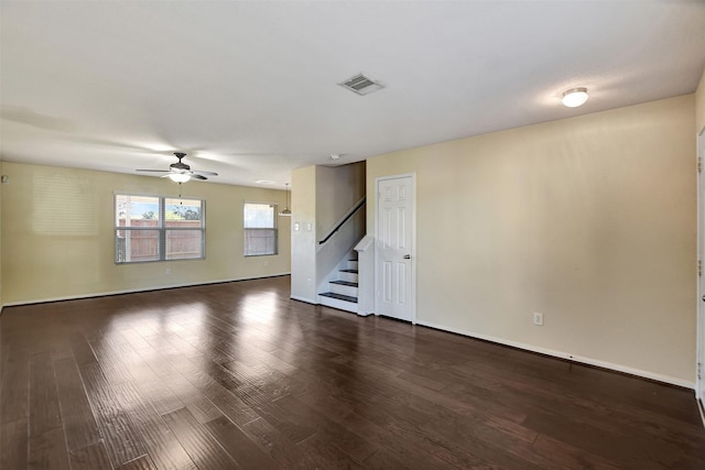 unfurnished room with dark hardwood / wood-style flooring and ceiling fan