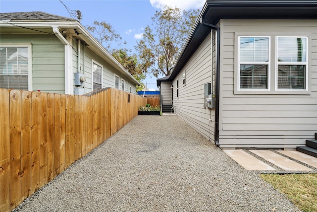 view of side of property featuring a patio