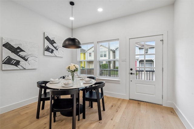 dining space featuring plenty of natural light and light wood-type flooring