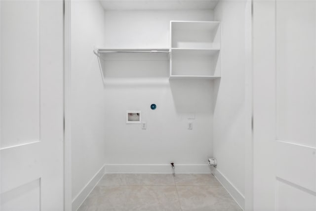 laundry room featuring hookup for a gas dryer, light tile patterned flooring, and hookup for a washing machine