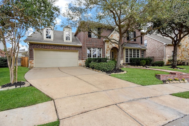 view of front of home featuring a front lawn and a garage