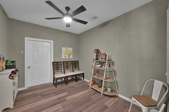 interior space featuring ceiling fan and dark wood-type flooring