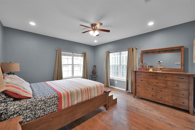 bedroom with ceiling fan and wood-type flooring