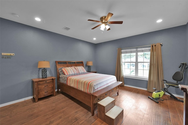 bedroom with ceiling fan and wood-type flooring