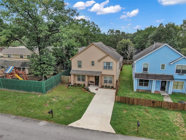 view of front of house featuring a patio area, a playground, and a front yard