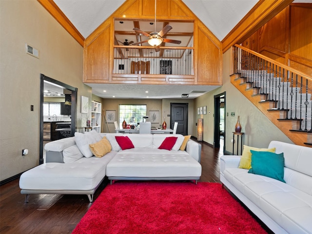 living room featuring ceiling fan, wood-type flooring, crown molding, and high vaulted ceiling