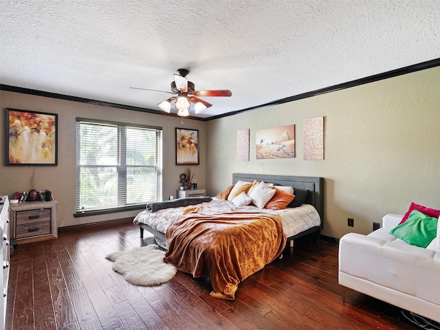 bedroom featuring ceiling fan, dark hardwood / wood-style flooring, a textured ceiling, and crown molding