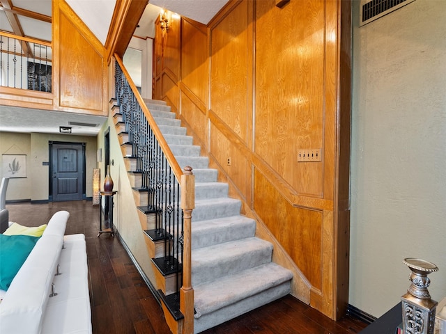 stairs with hardwood / wood-style flooring