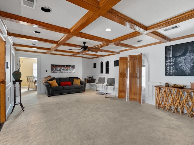 carpeted living room featuring beamed ceiling, ceiling fan, and coffered ceiling