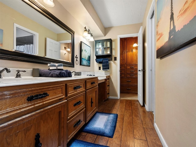 bathroom featuring vanity and wood-type flooring