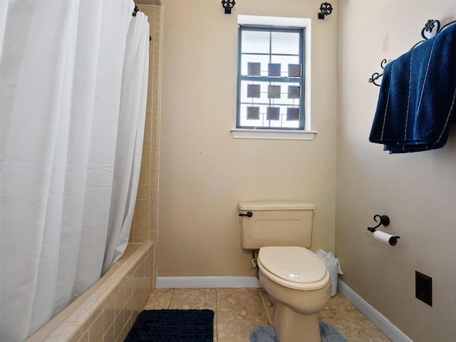 bathroom with tile patterned floors, toilet, and shower / bathtub combination with curtain